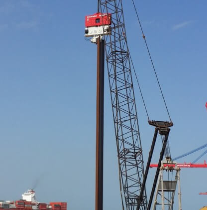 How does a vibratory hammer work in pile driving